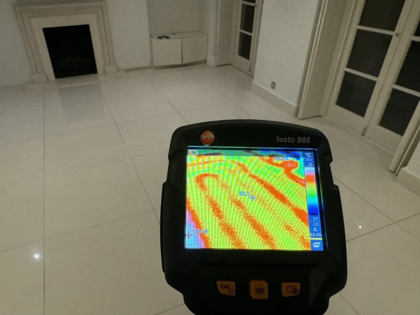 Thermal imaging leak detection camera showing heat signature of underfloor heating leak